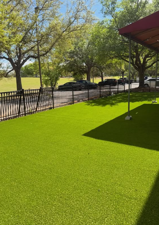 Commercial side lawn after synthetic turf installation